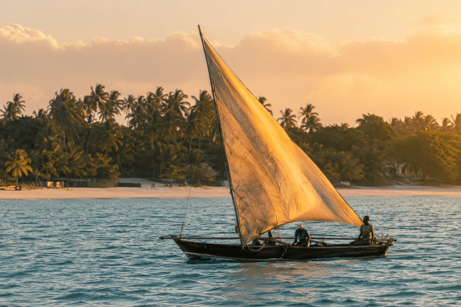Traditional wooden dhow sailing at sunset on the East African coast